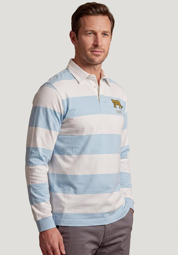 A man stands wearing an R1823 Argentina Heritage Cotton Rugby Shirt